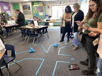 Teachers using Dash robots
